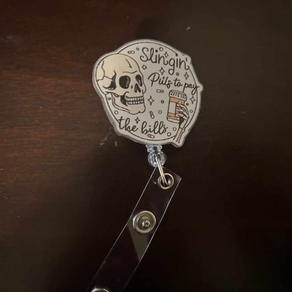 Skull Badge Reel - 'Slingin' Pills to Pay the Bills'